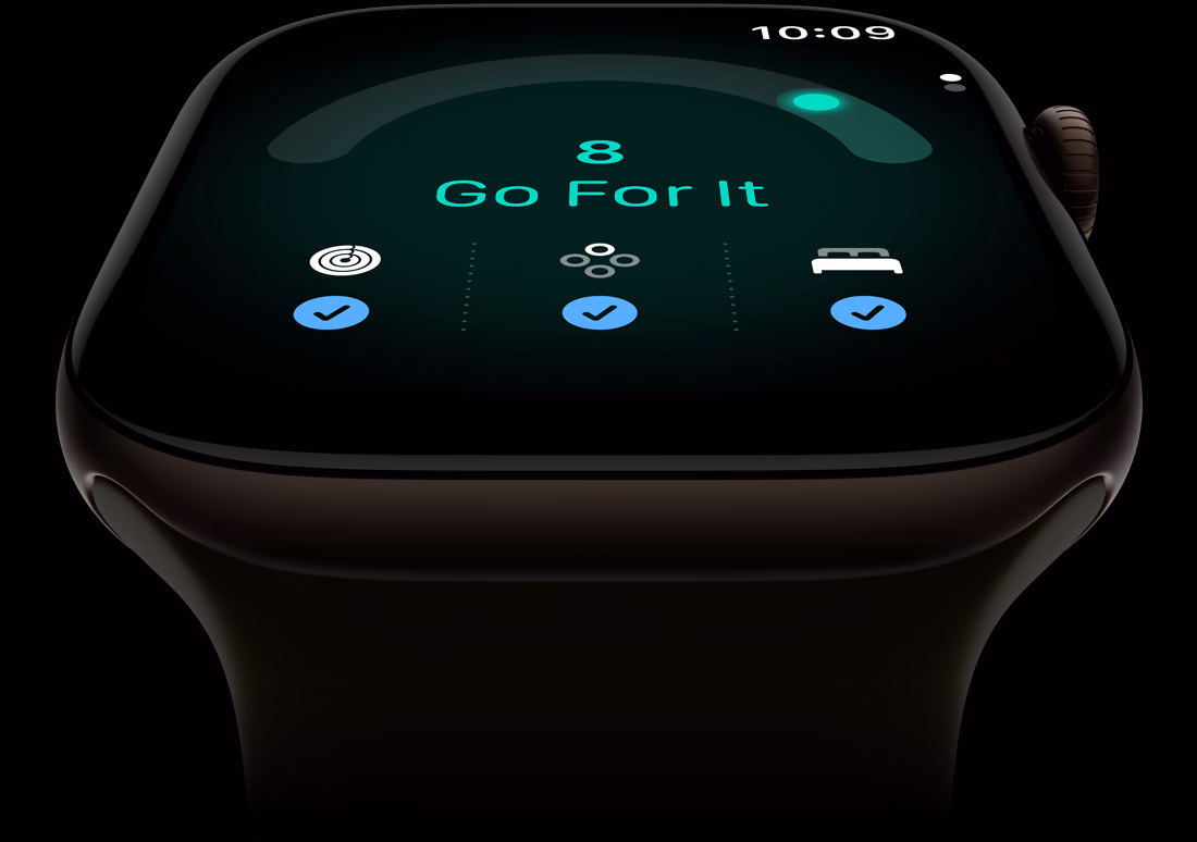 Apple Watch Series 12 med urkasse i aluminium i farven mørk bronze, kapacitetsscore på 8, Digital Crown i højre side og Sportsrem i olivengrøn