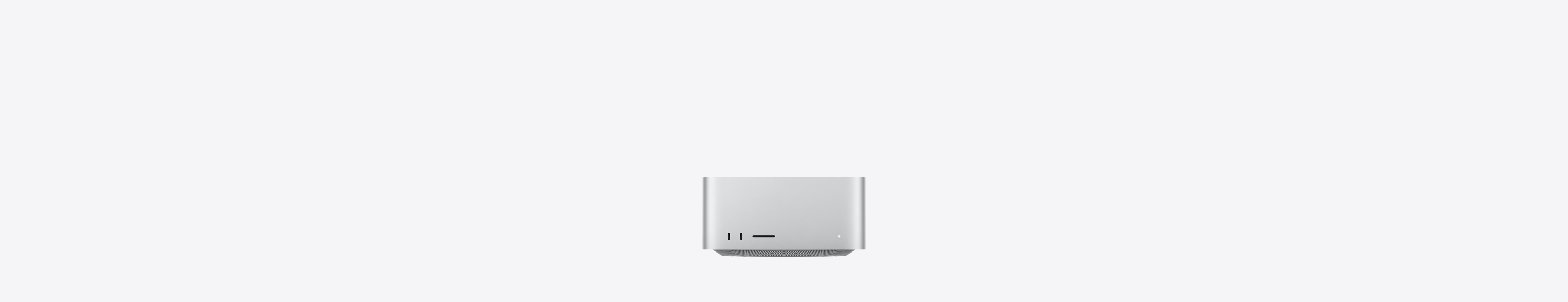Parte frontal de una Mac Studio color plata, dos puertos USB-C, ranura para tarjeta SDXC, luz indicadora de estado, base cónica en la parte inferior, superficie plana en la parte superior, lados redondeados y bordes rectos