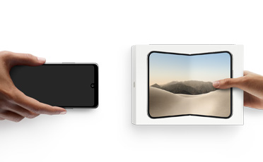 Hands exchanging phones, Android on the left without a box, on the right is a new iPhone Duo in box